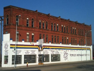 Vintage photo of People’s Restaurant Equipment Co’s exterior brick building  